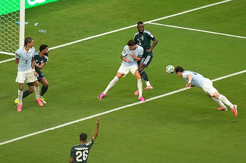 Uruguay's Federico Vinas, right, heads the ball against Saudi Arabia's Hassan Altambakti during the World Cup Group H soccer match between Saudi Arabia and Uruguay in Miami Gardens, Fla., Monday, June 15, 2026.