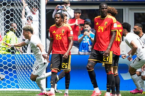 Egypt's Emam Ashour, left, celebrates after scoring his side's opening goal against Belgium during the World Cup Group G soccer match in Seattle, Monday, June 15, 2026.