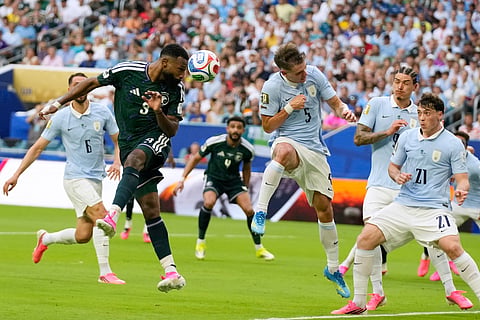 Saudi Arabia's Feras Albrikan head the ball during a World Cup Group H soccer match against Uruguay in Miami Gardens, Fla., Monday, June 15, 2026.