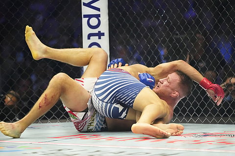 Ilia Toupruia, top, fights Justin Gaethje during UFC Freedom 250 on the South Lawn of the White House in Washington.