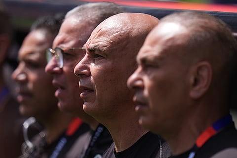 Egypt head coach Hossam Hassan, second left, with his other coaches on the sidelines during the World Cup Group G soccer match between Belgium and Egypt in Seattle, Monday, June 15, 2026.