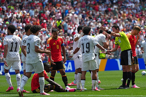 Referee Ramon Abatti, right, gestures to Egypt's Marawan Attia after awarding a direct free kick to Belgium during the World Cup Group G soccer match between Belgium and Egypt in Seattle, Monday, June 15, 2026.