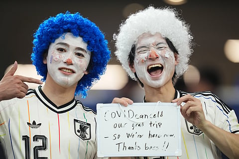 Fans of Japan pose for a photo during a World Cup Group F soccer match between the Netherlands and Japan in Arlington, Texas, near Dallas, Sunday, June 14, 2026.
