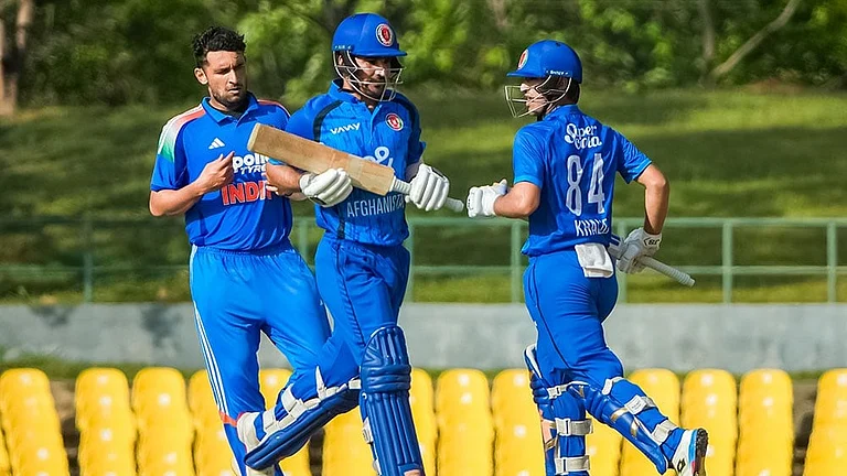 In this image received on June 11, 2026, Afghanistan's captain Imran, centre, and Khalid Taniwal run between the wickets during an ODI cricket match between India-A and Afghanistan-A, in Dambulla, Sri Lanka. - Photo: SLC via PTI