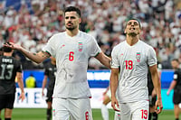 AP Photo/Andre Penner : Iran's Ali Nemati, right, and Saeid Ezatolahi react after a disallowed goal during the World Cup Group G soccer match between Iran and New Zealand in Inglewood, Calif., near Los Angeles, Monday, June 15, 2026.