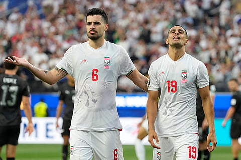 Iran's Ali Nemati, right, and Saeid Ezatolahi react after a disallowed goal during the World Cup Group G soccer match between Iran and New Zealand in Inglewood, Calif., near Los Angeles, Monday, June 15, 2026.