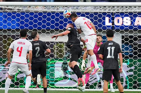 Iran's Ali Nemati (19) heads the ball for a goal that was disallowed for offside during the World Cup Group G soccer match between Iran and New Zealand in Inglewood, Calif., near Los Angeles, Monday, June 15, 2026.