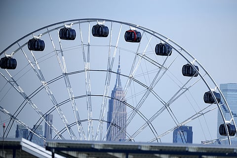 The Empire State Building is seen behind a ferris wheel during the World Cup Group I soccer match between France and Senegal in East Rutherford, N.J., near New York, Tuesday, June 16, 2026.