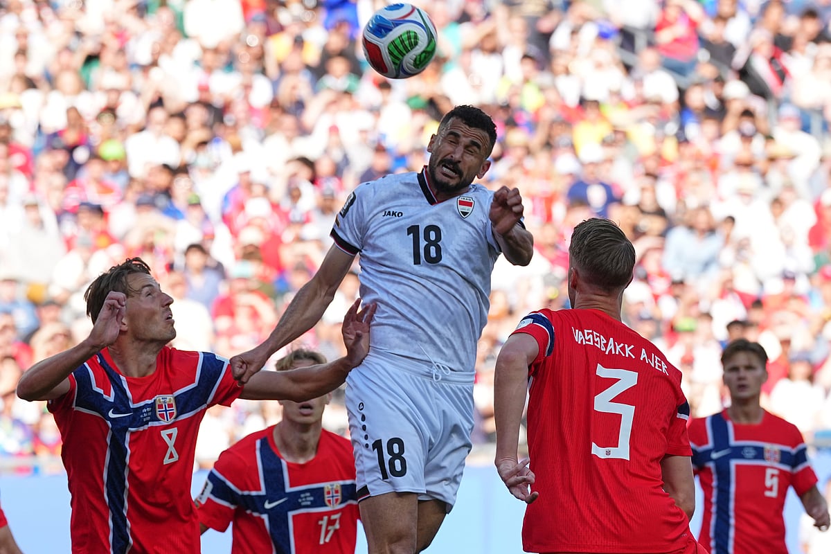 Iraq's Aymen Hussein, top, heads the ball during the World Cup Group I soccer match between Iraq and Norway in Foxborough, Mass., near Boston, Tuesday, June 16, 2026. - AP Photo/Martin Meissner
