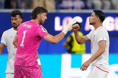 New Zealand goalkeeper Max Crocombe (1) talks with Iran's Ali Alipour (11) after a draw in the World Cup Group G soccer match between Iran and New Zealand in Inglewood, Calif., near Los Angeles, Monday, June 15, 2026.