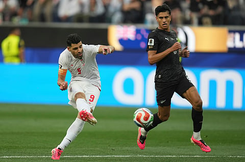 Iran's Mohammad Mohebbi (8) battles for the ball with New Zealand's Chris Wood (9) during the World Cup Group G soccer match between Iran and New Zealand in Inglewood, Calif., near Los Angeles, Monday, June 15, 2026.