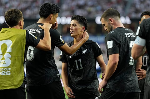 New Zealand's Elijah Just (11) celebrates with his teammates after scoring a goal during the World Cup Group G soccer match between Iran and New Zealand in Inglewood, Calif., near Los Angeles, Monday, June 15, 2026.