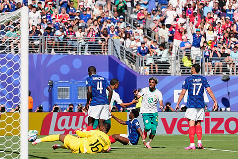 Senegal's Ibrahim Mbaye, center, celebrates after scoring his side's first goal during the World Cup Group I soccer match between France and Senegal in East Rutherford, N.J., near New York, Tuesday, June 16, 2026.