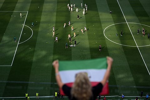 Fans cheer as Iran players warm up before the World Cup Group G soccer match between Iran and New Zealand in Inglewood, Calif., near Los Angeles, Monday, June 15, 2026.