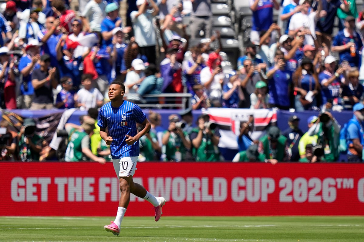 France's Kylian Mbappe warms up before the start of the World Cup Group I soccer match - AP Photo/Frank Franklin II