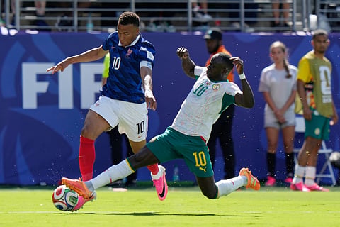 Senegal's Sadio Mane, right, slides in on France's Kylian Mbappe (10) during the World Cup Group I soccer match between France and Senegal in East Rutherford, N.J., near New York, Tuesday, June 16, 2026.