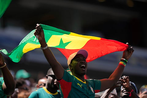 A supporter of Senegal cheers before the start of the World Cup Group I soccer match between France and Senegal in East Rutherford, N.J., near New York, Tuesday, June 16, 2026.