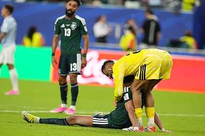 AP Photo/Lynne Sladky : Saudi Arabia goalkeeper Mohammed Al-Owais embraces a teammate after their 1-1 draw with Uruguay in the FIFA World Cup 2026 Group H match in Miami Gardens, Fla., Monday, June 15, 2026.