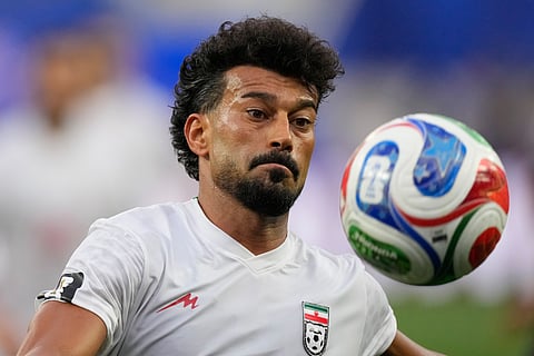 Iran's Ramin Rezaeian (23) eyes the ball during the World Cup Group G soccer match between Iran and New Zealand in Inglewood, Calif., near Los Angeles, Monday, June 15, 2026.