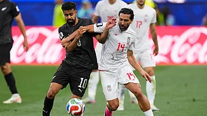 (AP Photo/Mark J. Terrill) : New Zealand's Sarpreet Singh (10) battles for the ball with Iran's Saman Ghoddos (14) during the World Cup Group G soccer match between Iran and New Zealand in Inglewood, Calif., near Los Angeles, Monday, June 15, 2026