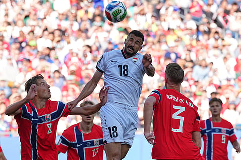 Iraq's Aymen Hussein, top, heads the ball during the World Cup Group I soccer match between Iraq and Norway in Foxborough, Mass., near Boston, Tuesday, June 16, 2026.