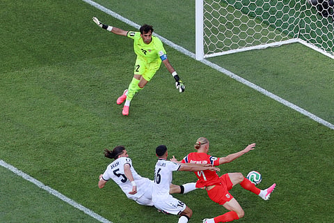 Norway's Erling Haaland (9) scores the opening goal against Iraq goalkeeper Jalal Hassan (12) during the World Cup Group I soccer match between Iraq and Norway in Foxborough, Mass., near Boston, Tuesday, June 16, 2026.
