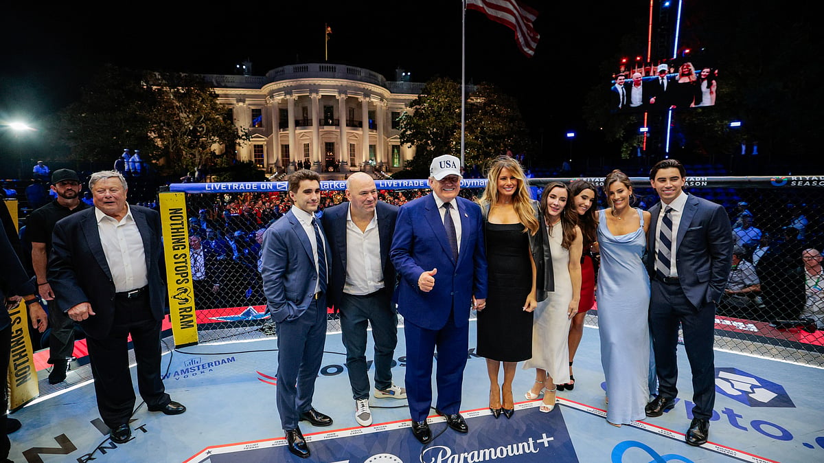 President Donald Trump, first lady Melania Trump, UFC President and CEO Dana White and other guests pose inside the octagon after UFC Freedom 250 on the South Lawn of the White House, Monday, June 15, 2026, in Washington. - (Evan Vucci/Pool Photo via AP)