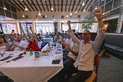 Fans watch a televised World Cup Group G soccer match between Iran and New Zealand, Monday, June 15, 2026, in Los Angeles.