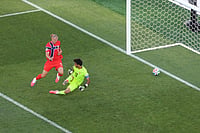 AP Photo/Mark Stockwell : Norway's Erling Haaland (9) scores his second goal of the match against Iraq goalkeeper Jalal Hassan (12) during the World Cup Group I soccer match between Iraq and Norway in Foxborough, Mass., near Boston, Tuesday, June 16, 2026.