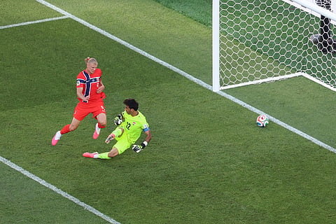 Norway's Erling Haaland (9) scores his second goal of the match against Iraq goalkeeper Jalal Hassan (12) during the World Cup Group I soccer match between Iraq and Norway in Foxborough, Mass., near Boston, Tuesday, June 16, 2026.