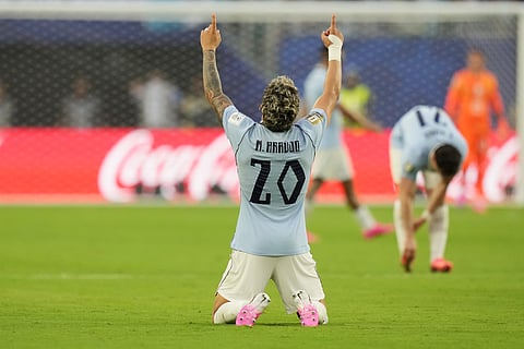 Uruguay's Maxi Araujo celebrates scoring his side's opening goal against Saudi Arabia during a World Cup Group H soccer match in Miami Gardens, Fla., Monday, June 15, 2026.