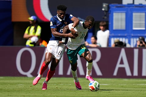 France's Aurelien Tchouameni, left, and Senegal's Nicolas Jackson fight for the ball during the World Cup Group I soccer match between France and Senegal in East Rutherford, N.J., near New York, Tuesday, June 16, 2026.