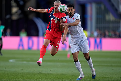 Norway's Erling Haaland (9), left, and Iraq's Zaid Tahseen (4) compete for the ball during the World Cup Group I soccer match between Iraq and Norway in Foxborough, Mass., near Boston, Tuesday, June 16, 2026.