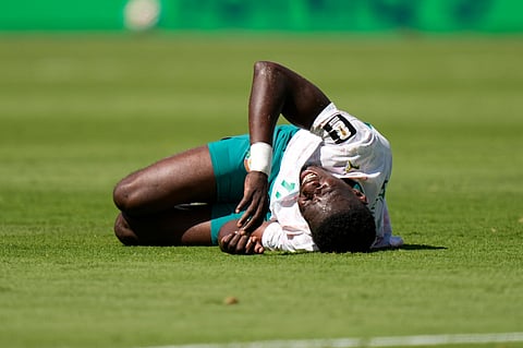 Senegal's Ismaila Sarr lays on the ground during the World Cup Group I soccer match between France and Senegal in East Rutherford, N.J., near New York, Tuesday, June 16, 2026.