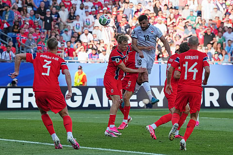 Iraq's Aymen Hussein, top, scores his side's first goal during the World Cup Group I soccer match between Iraq and Norway in Foxborough, Mass., near Boston, Tuesday, June 16, 2026.