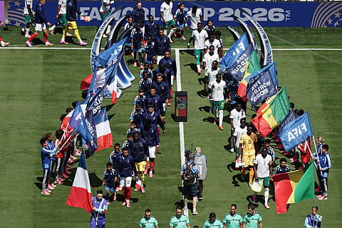 French, left, and Senegalese players walk onto the pitch before the World Cup Group I soccer match between France and Senegal in East Rutherford, N.J., near New York, Tuesday, June 16, 2026.