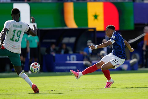 France's Kylian Mbappe (10) shoots and scores their second goal during the World Cup Group I soccer match between France and Senegal in East Rutherford, N.J., near New York, Tuesday, June 16, 2026.