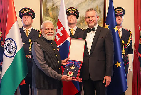 Prime Minister Narendra Modi receives the Order of the 'White Double Cross, 1st Class', the highest national honour of the Slovak Republic, from Slovak President Peter Pellegrini during a ceremony, in Slovakia. 
