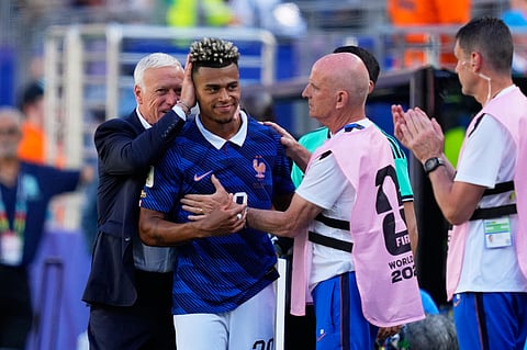 France head coach Didier Deschamps pats France's Desire Doue on the head after he was substituted during the World Cup Group I soccer match between France and Senegal in East Rutherford, N.J., near New York, Tuesday, June 16, 2026.