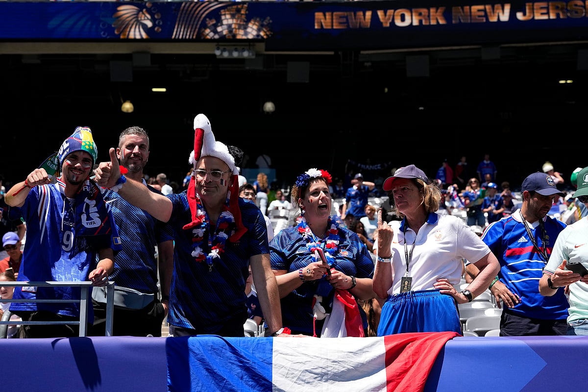 Supporters of France wait for the start of the World Cup Group I soccer match between France and Senegal - AP