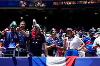 AP : Supporters of France wait for the start of the World Cup Group I soccer match between France and Senegal