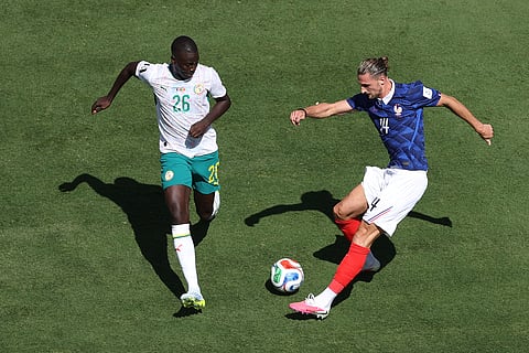 Senegal's Pape Gueye (26) and France's Adrien Rabiot (14) battle during the World Cup Group I soccer match between France and Senegal in East Rutherford, N.J., near New York, Tuesday, June 16, 2026.
