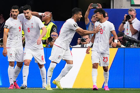 Iran's Mohammad Mohebbi (8) celebrates a goal by Ramin Rezaeian (23) during the World Cup Group G soccer match between Iran and New Zealand in Inglewood, Calif., near Los Angeles, Monday, June 15, 2026.