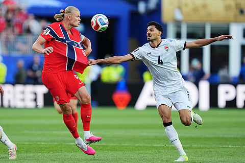 Iraq's Zaid Tahseen, right, grabs Norway's Erling Haaland during the World Cup Group I soccer match between Iraq and Norway in Foxborough, Mass., near Boston, Tuesday, June 16, 2026.
