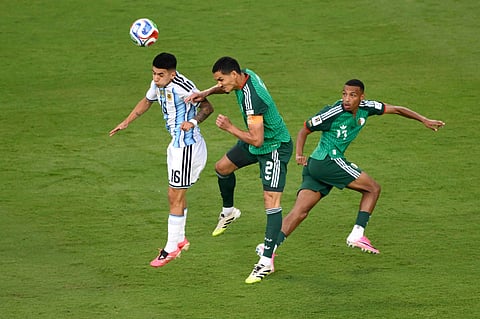 Argentina's Thiago Almada (16) challenges for the ball with Algeria's Aissa Mandi (2) during the World Cup Group J soccer match between Argentina and Algeria in Kansas City, Mo., Tuesday, June 16, 2026.
