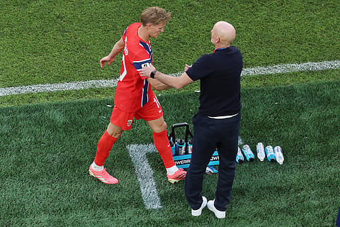Norway head coach Stale Solbakken congratulates Norway's Martin Oedegaard (10) as he comes to the bench during the World Cup Group I soccer match between Iraq and Norway in Foxborough, Mass., near Boston, Tuesday, June 16, 2026.