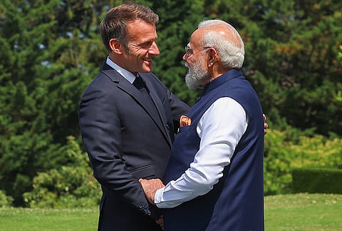Prime Minister Narendra Modi being welcomed by French President Emmanuel Macron for the G7 Summit, in Evian-les-Bains, France. 