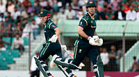 (AP Photo/Mosaraf Hossain) : Australia's Cooper Connolly, left and captain Mitchell Marsh run between the wickets to score during the first T20 international cricket match between Australia and Bangladesh, in Chattogram , Bangladesh, Wednesday, June 17, 2026.