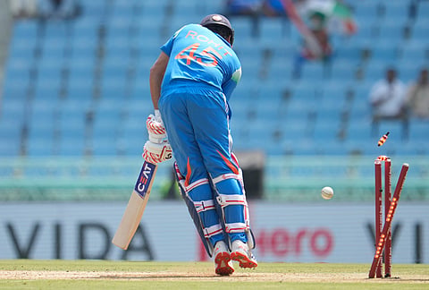 India's Rohit Sharma is bowled out by Afghanistan's Rashid Khan during the second ODI cricket match between India and Afghanistan in Lucknow.