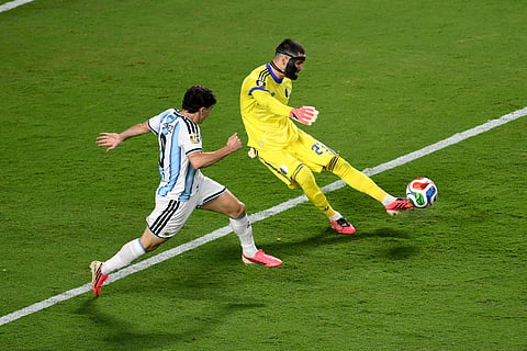 Algeria goalkeeper Luca Zidane (23) clears the ball against Argentina's Julian Alvarez (9) during the World Cup Group J soccer match between Argentina and Algeria in Kansas City, Mo., Tuesday, June 16, 2026.